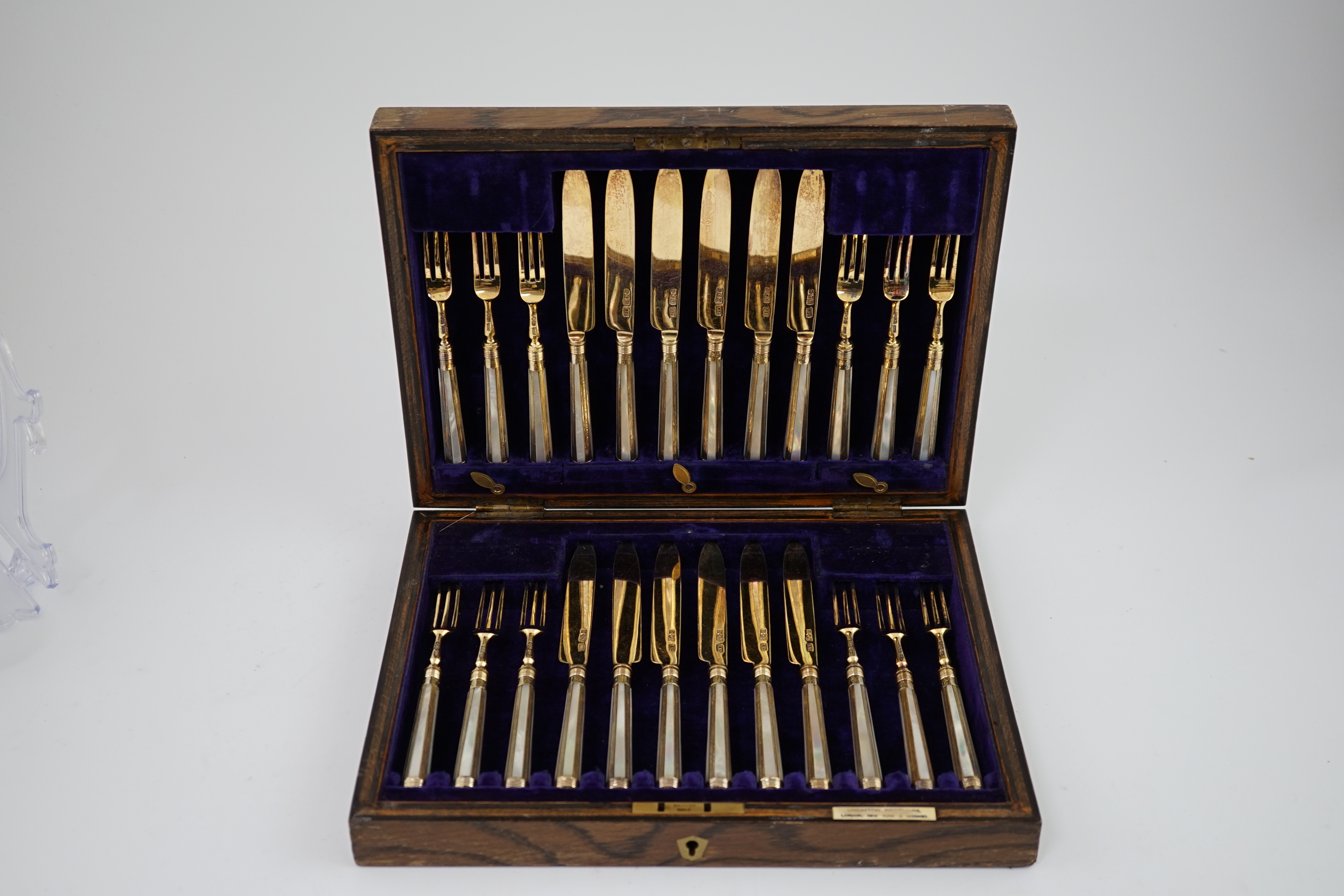 A cased set of twelve pairs of George V silver gilt dessert eaters by Crichton Brothers